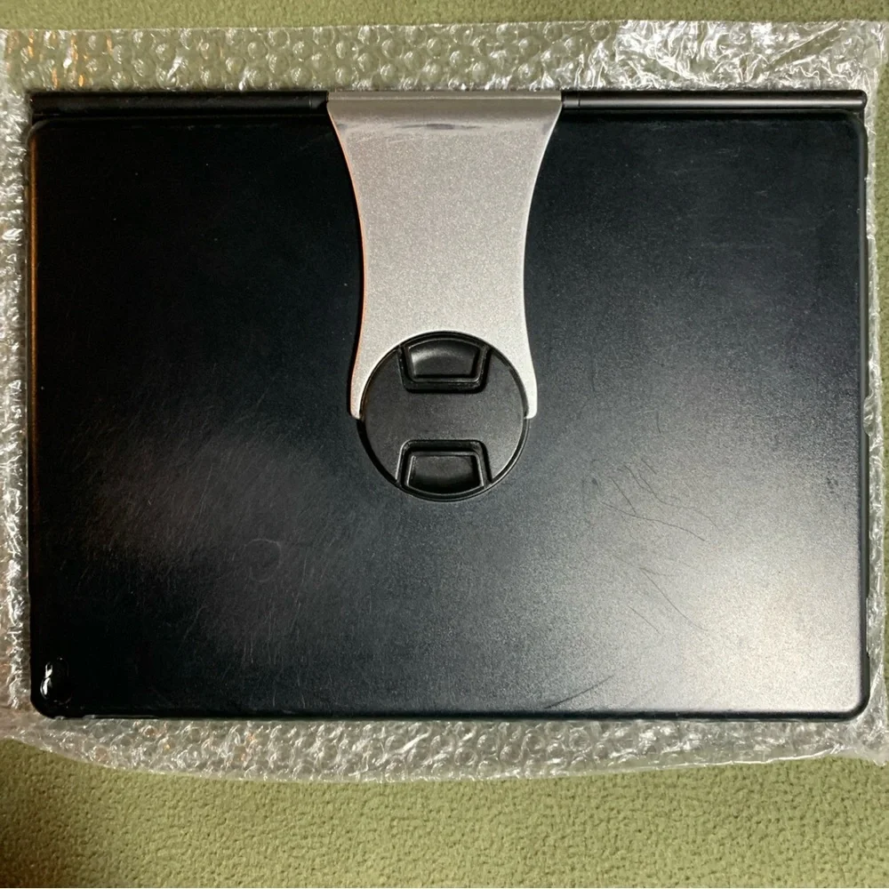 FUC ProCase keyboard case for iPad Pro 12.9”. Black and silver. Charging cord.